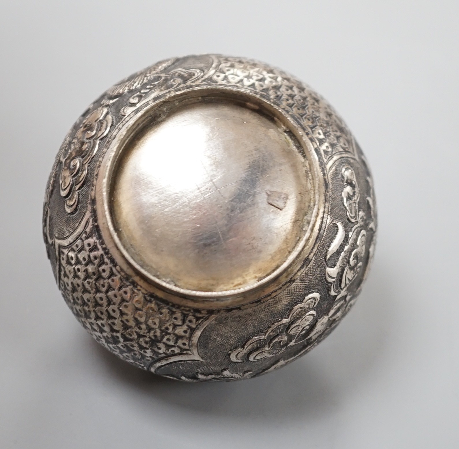 A Chinese white metal unsigned pot and cover, 5cms high.